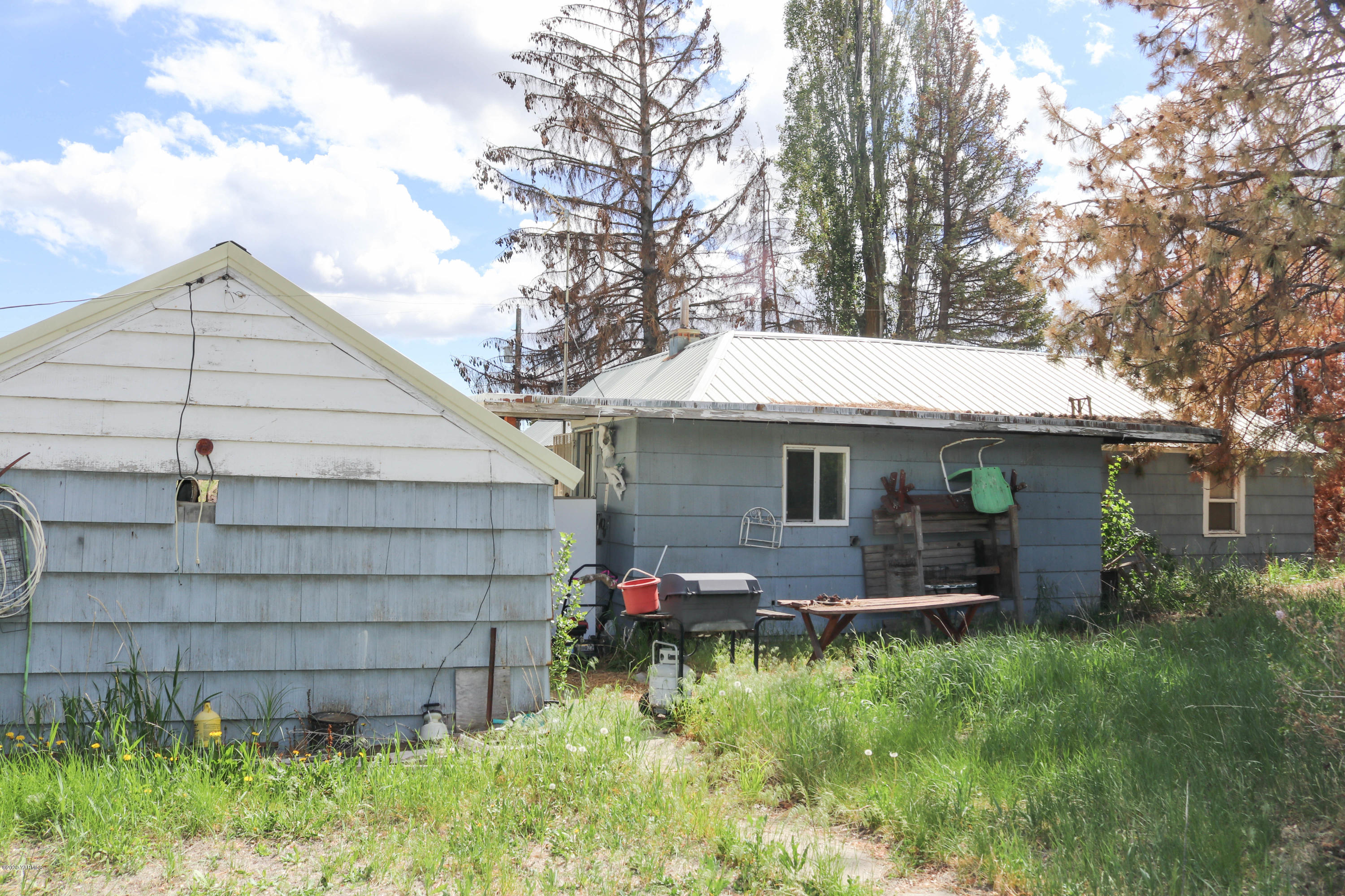 2412 Carlson Road Yakima, WA 98903 - Photo 14 of 24 a front view of house with yard and trees in the background