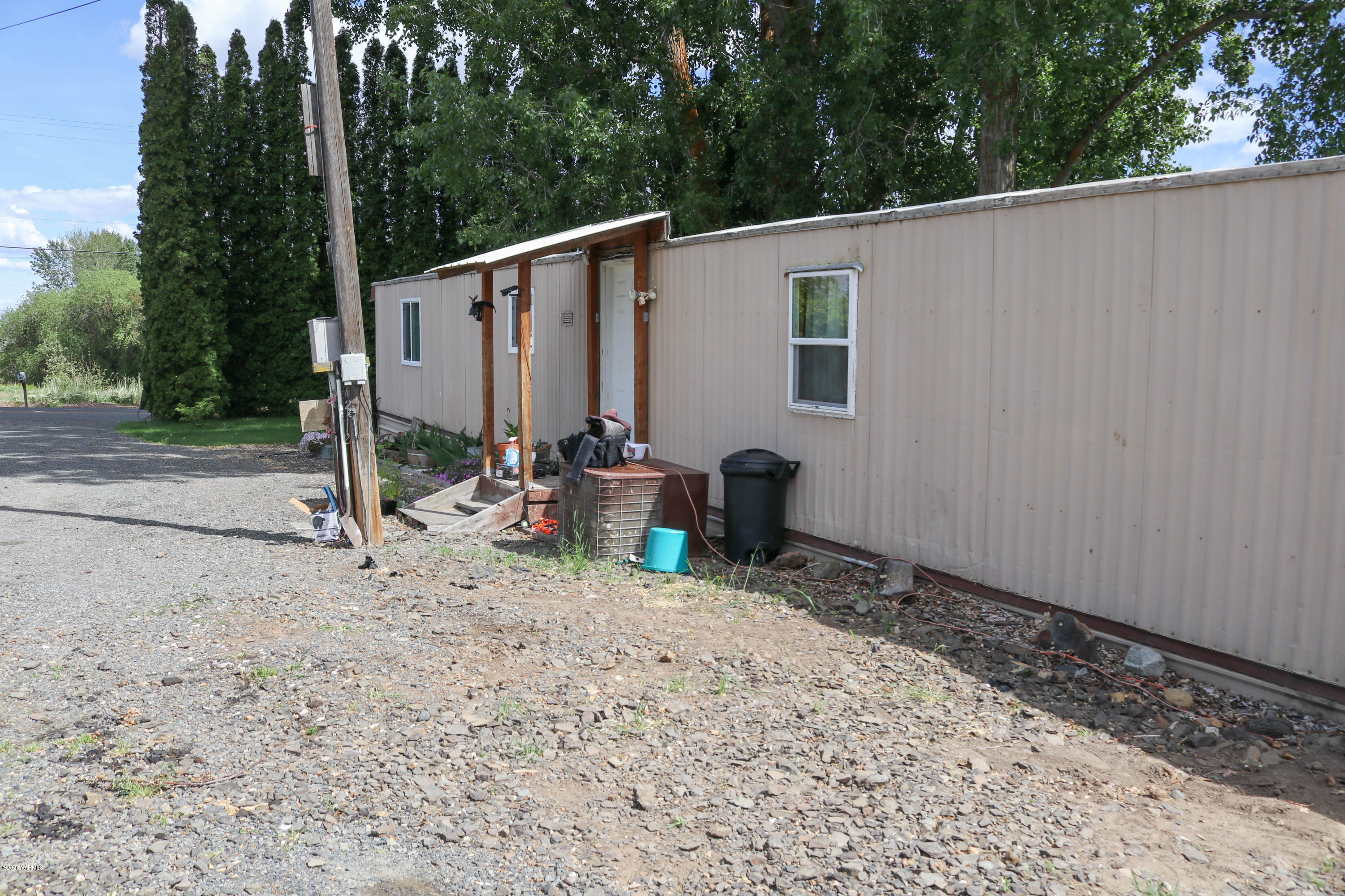 2412 Carlson Road Yakima, WA 98903 - Photo 22 of 24 a view of a backyard with couches and wooden fence