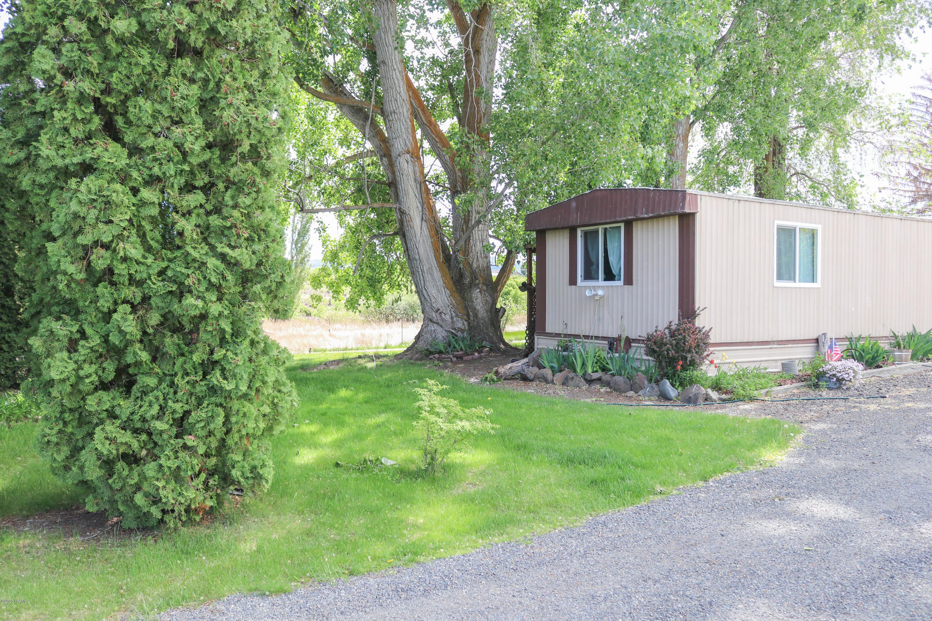 2412 Carlson Road Yakima, WA 98903 - Photo 23 of 24 a house that has a tree in front of it