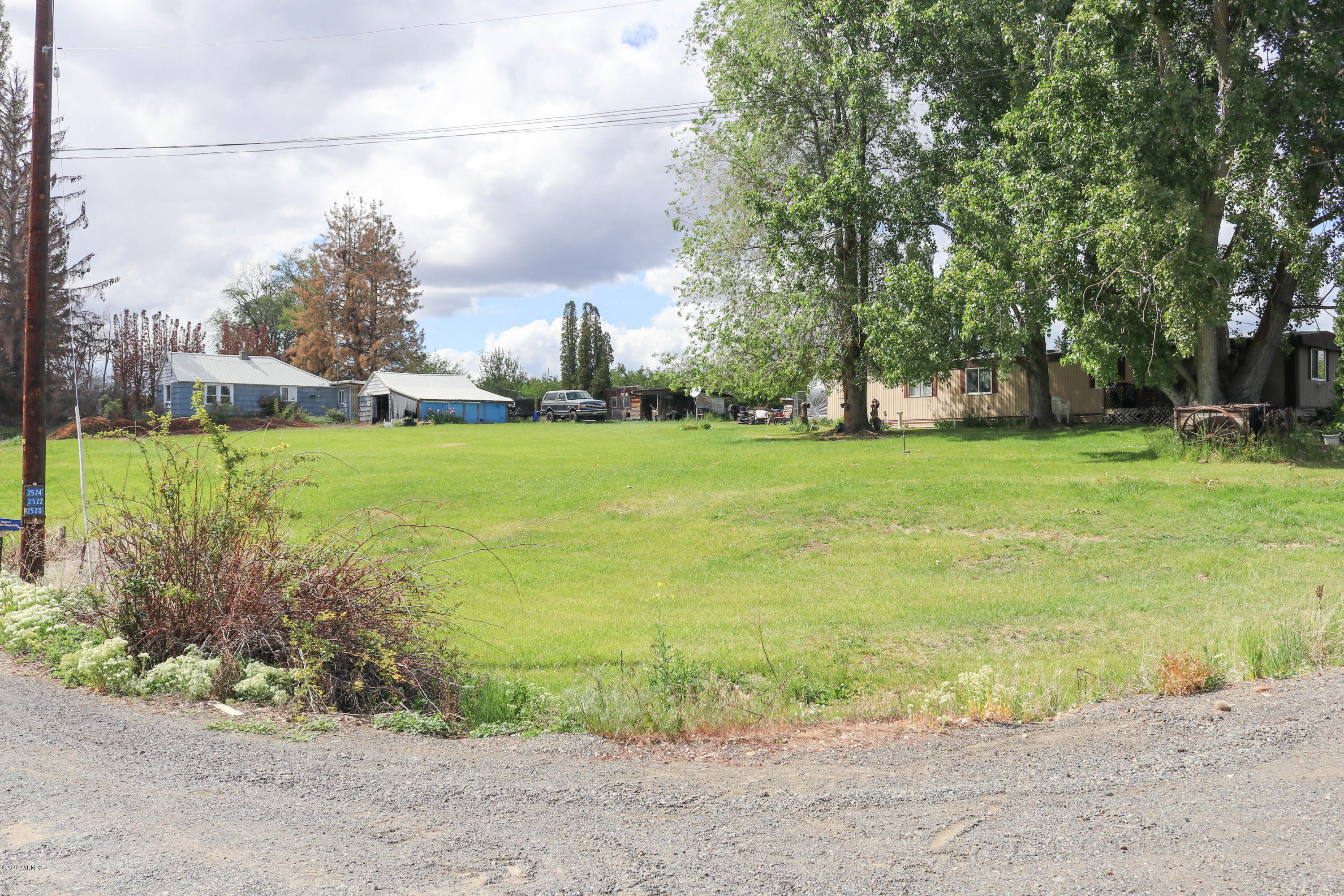 2412 Carlson Road Yakima, WA 98903 - Photo 24 of 24 a view of a big yard with plants and large trees