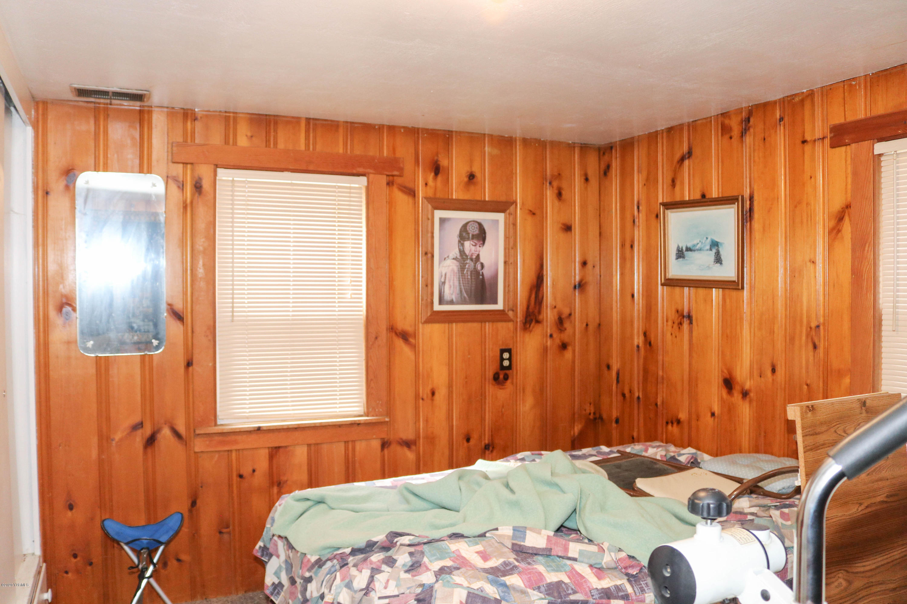 2412 Carlson Road Yakima, WA 98903 - Photo 10 of 24 a bedroom with a bed and a window