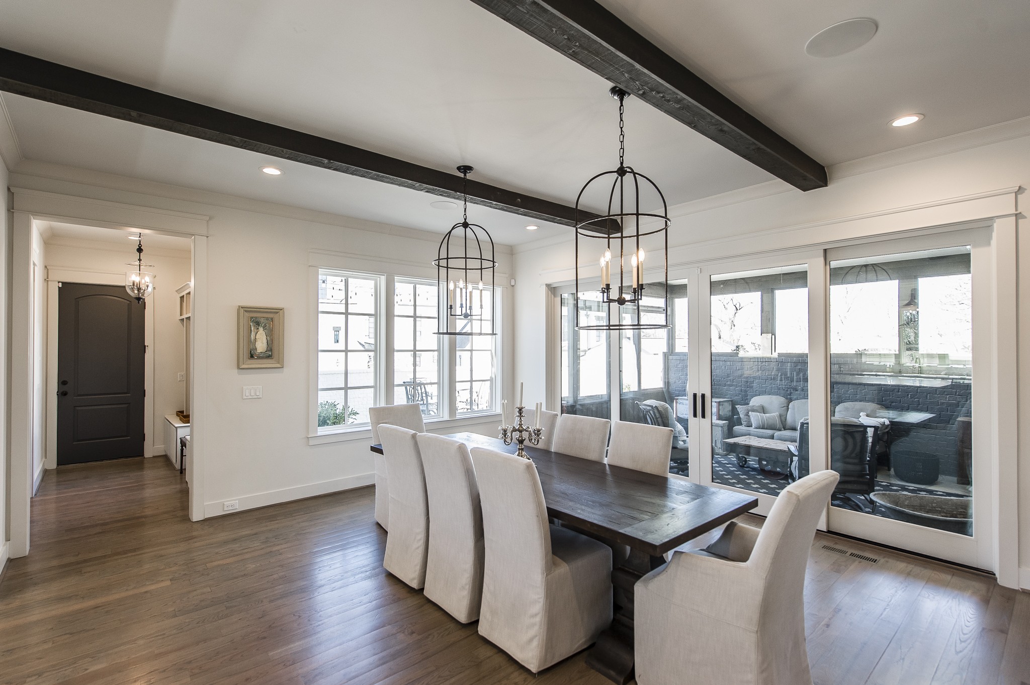 1132 Glenwood Avenue Nashville, TN 37204 - Photo 15 of 61 a view of a dining room with furniture large windows and wooden floor
