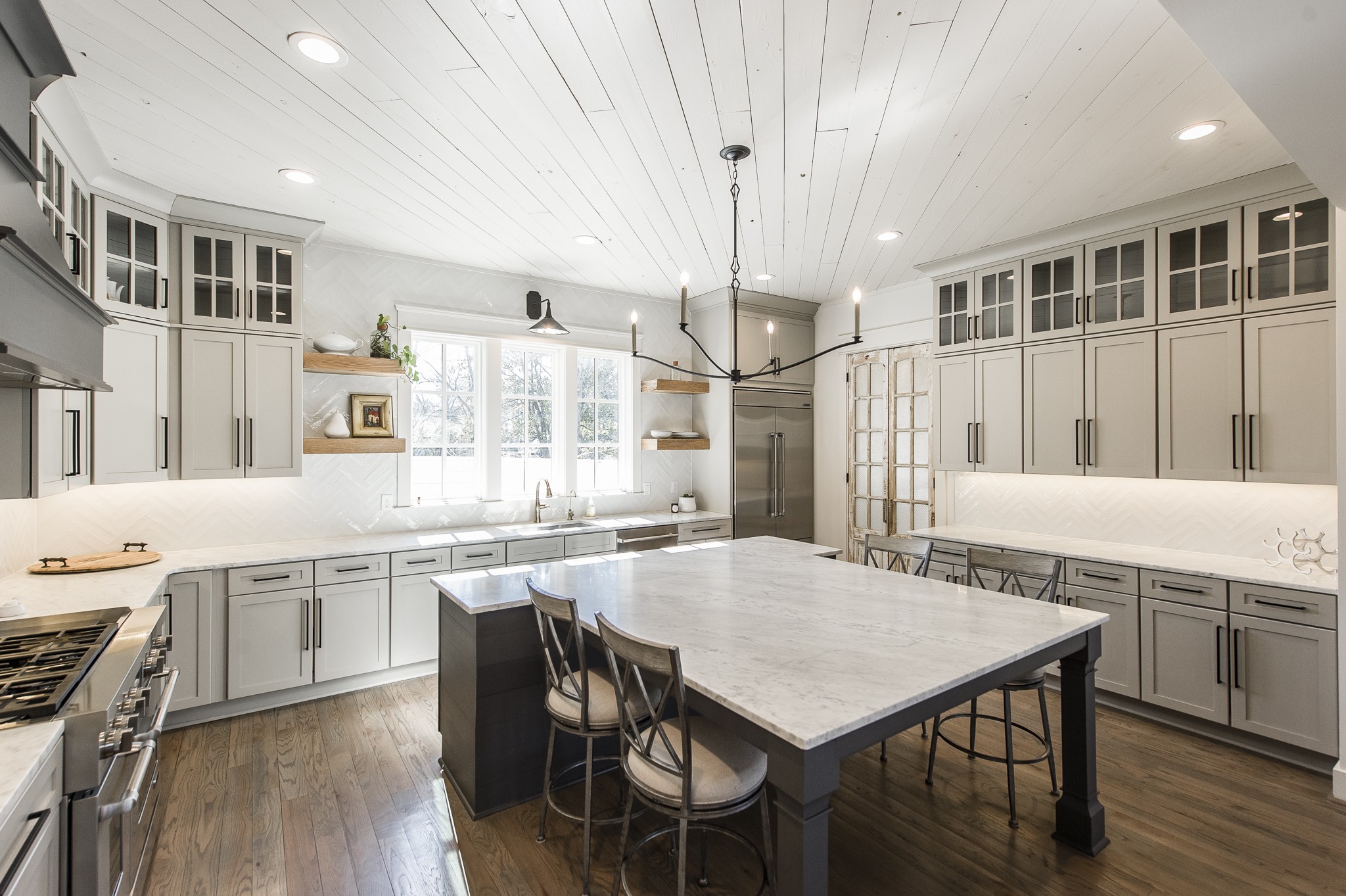 1132 Glenwood Avenue Nashville, TN 37204 - Photo 18 of 61 a kitchen with stainless steel appliances granite countertop a kitchen island a stove a table and chairs