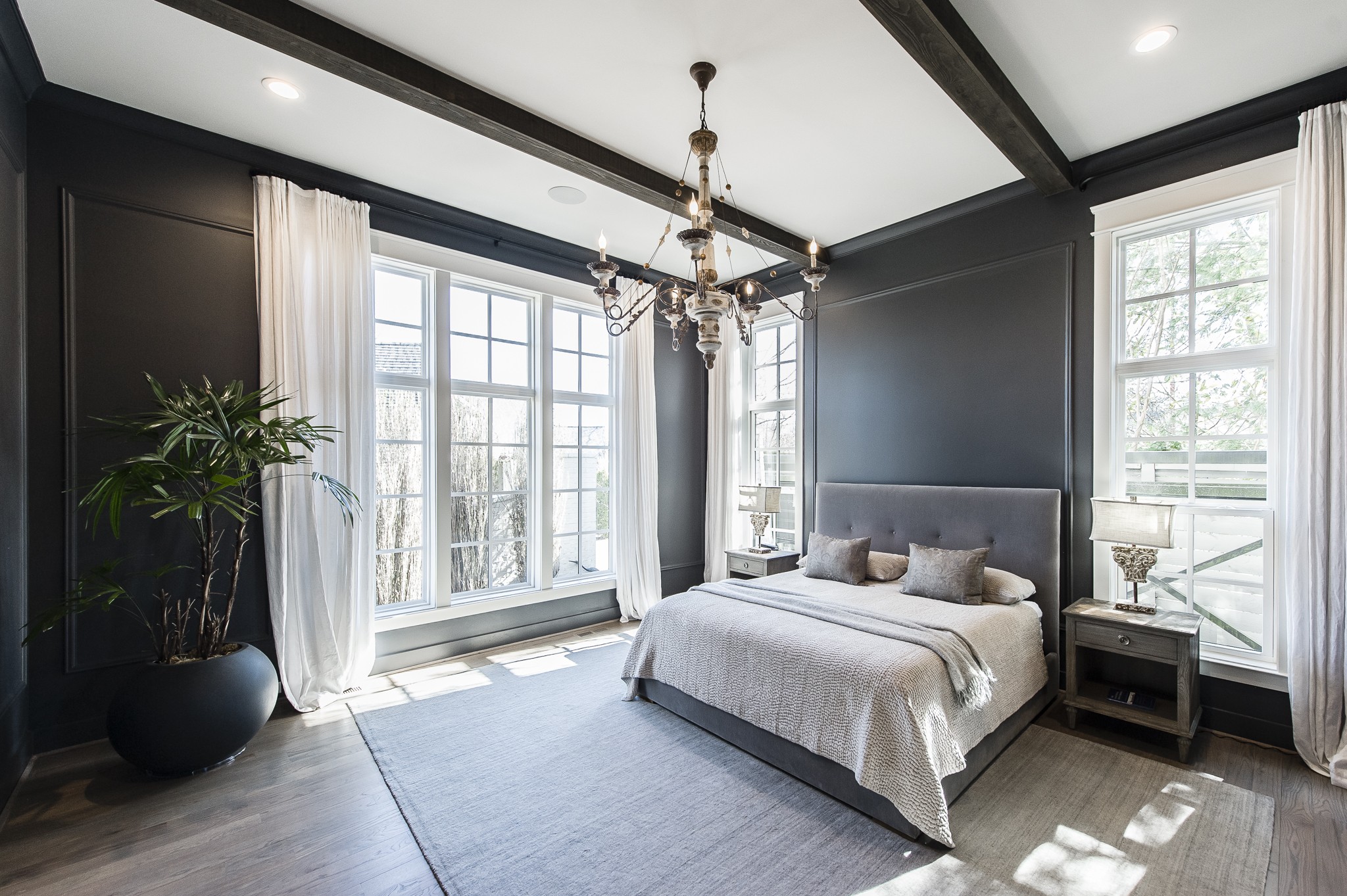 1132 Glenwood Avenue Nashville, TN 37204 - Photo 27 of 61 a bedroom with a large bed and a chandelier