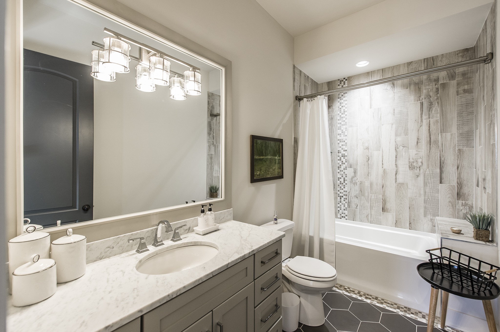 1132 Glenwood Avenue Nashville, TN 37204 - Photo 36 of 61 a bathroom with a granite countertop sink toilet a large mirror and shower