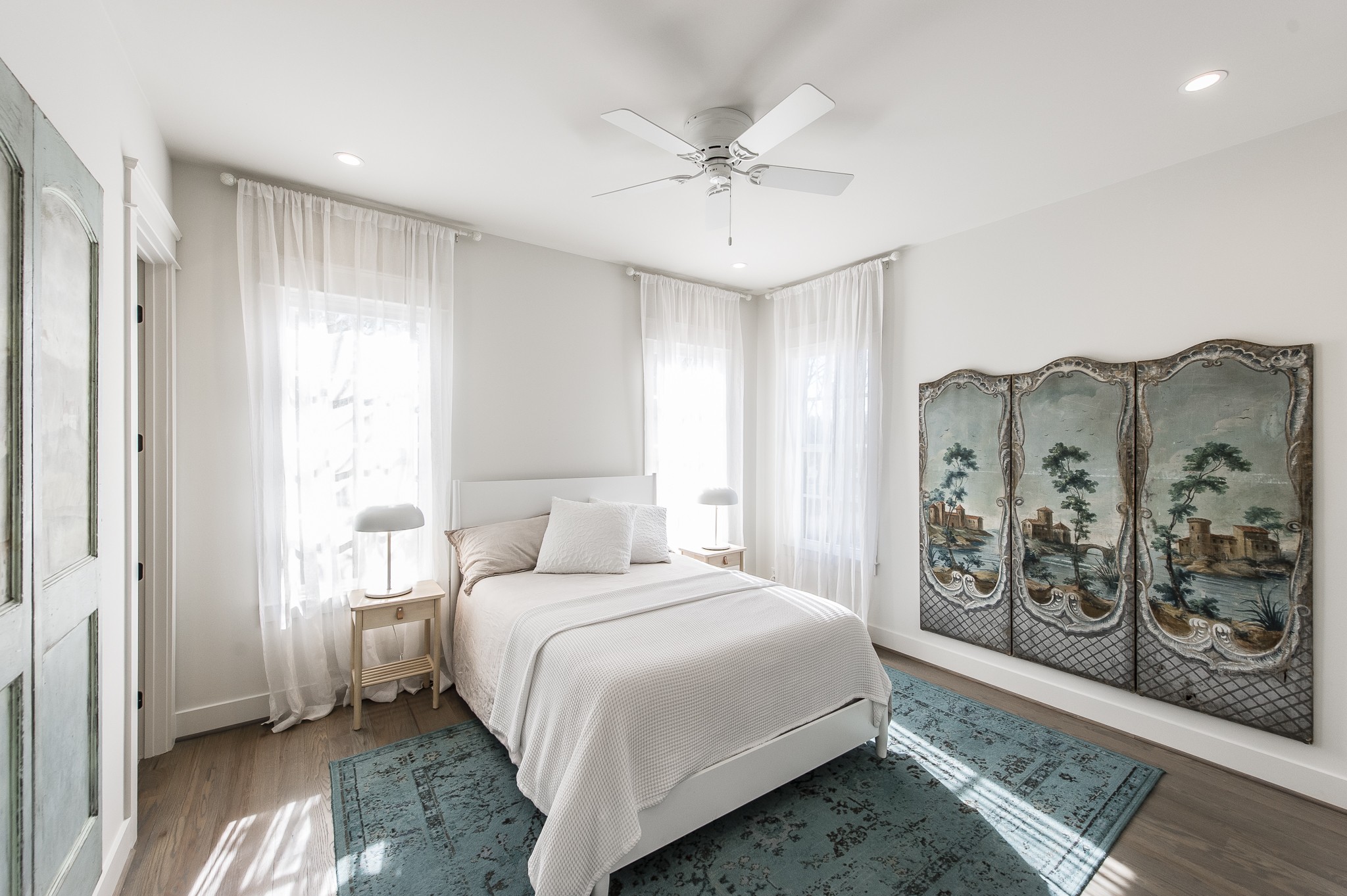 1132 Glenwood Avenue Nashville, TN 37204 - Photo 42 of 61 a bedroom with a large bed and a chandelier