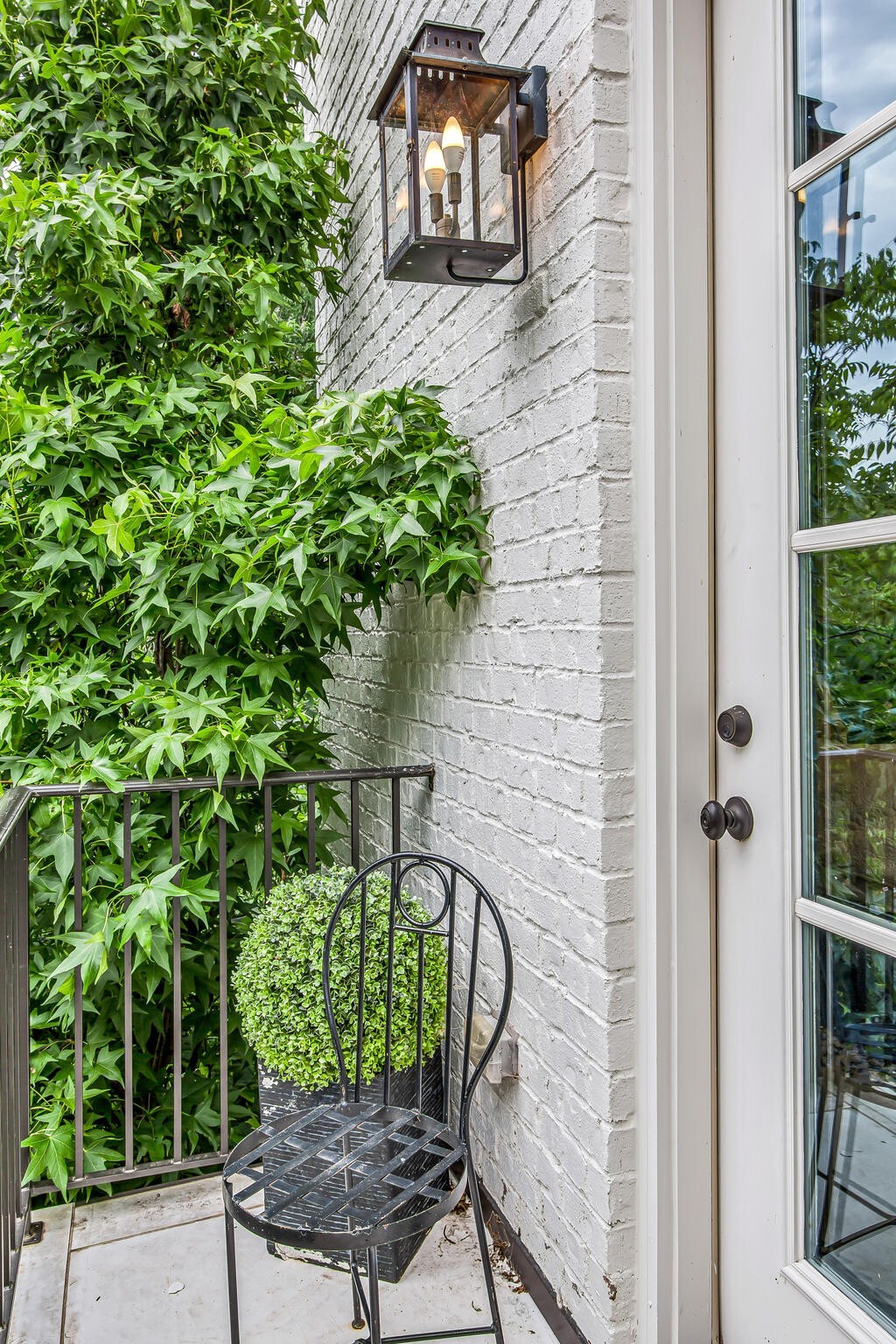 1132 Glenwood Avenue Nashville, TN 37204 - Photo 45 of 61 a couple of potted plants in front of door