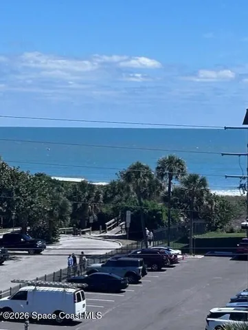 a view of a street with cars