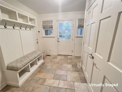 a bathroom with a granite countertop bathtub a sink and a shower