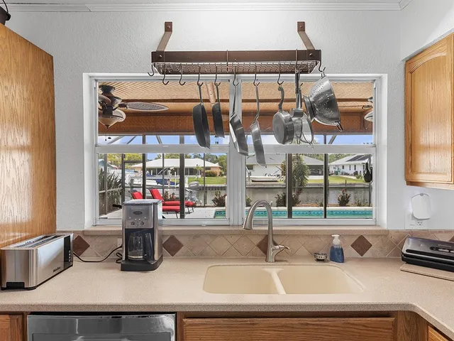 a kitchen with a sink and a window