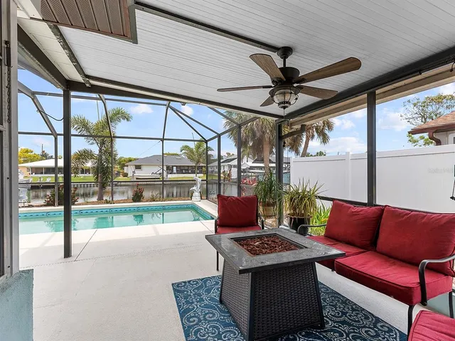 a living room with a couch a large window and a table