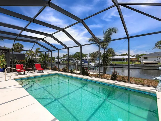 a view of a swimming pool with a patio