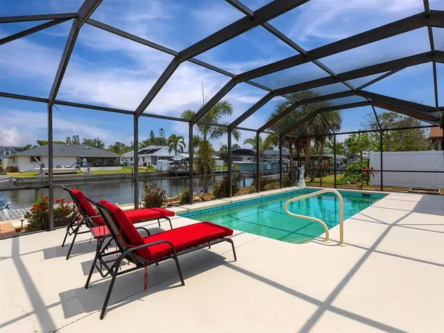 a view of a backyard with sitting area