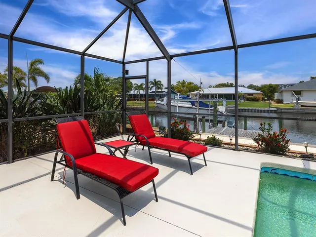 a roof deck with a table and chairs
