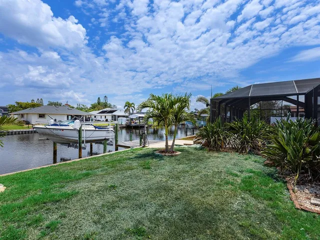 a view of a chairs and table in the garden
