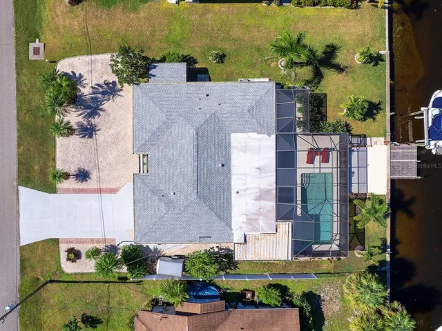 an aerial view of a house with a garden