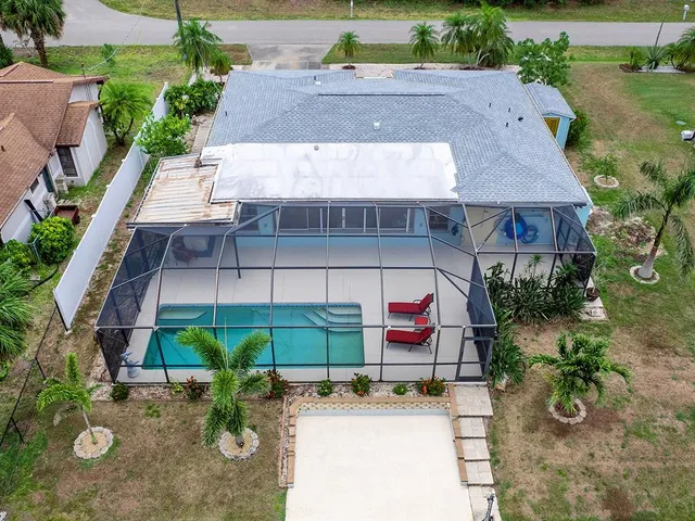 an aerial view of a house with a garden