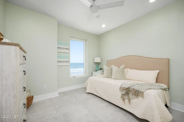 a bathroom with a large tub a sink and a large mirror