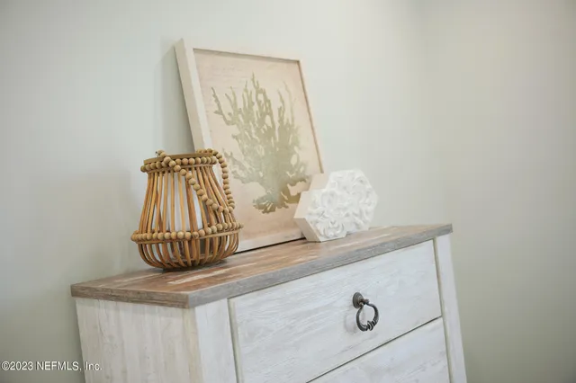 a white bath tub sitting next to a chair