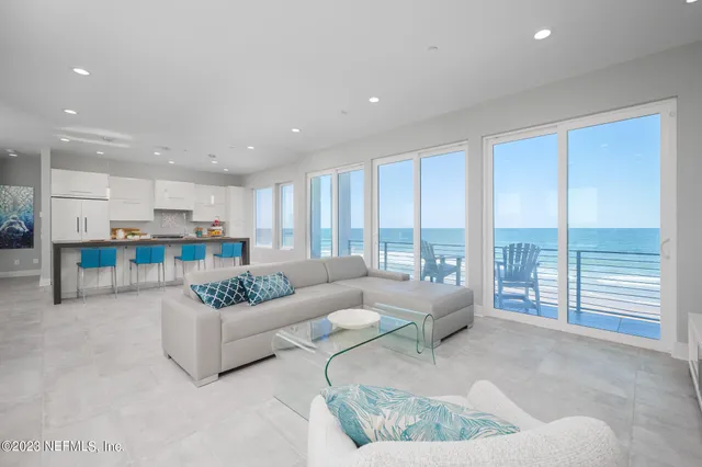 a lots of white furniture and water view