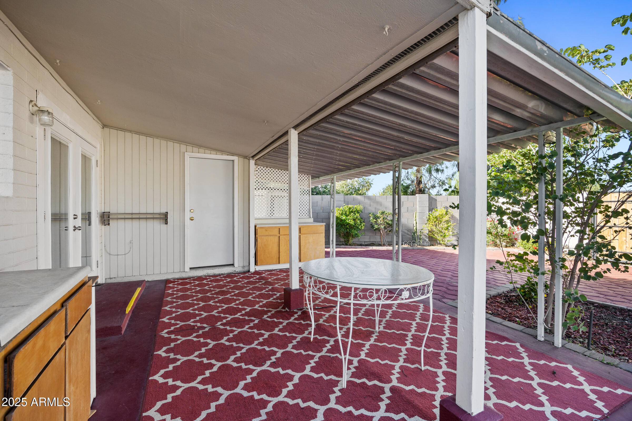 1614 West Inverness Drive Tempe, AZ 85282 - Photo 26 of 27 a backyard of a house with table and chairs