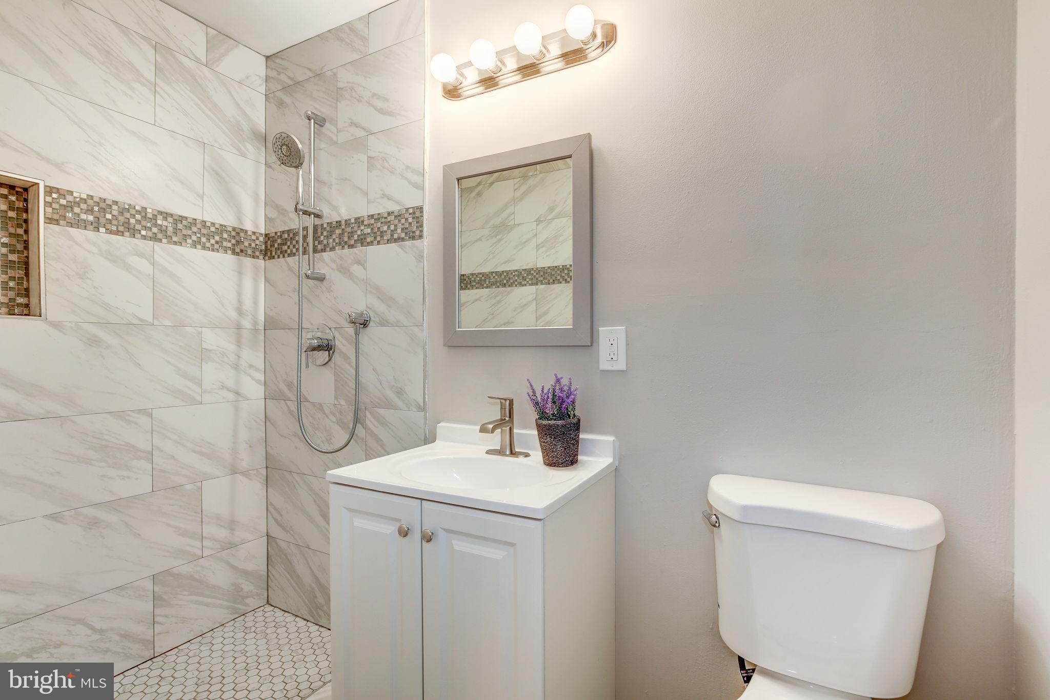 2394 Southgate Square Reston, VA 20191 - Photo 24 of 58 a bathroom with a sink toilet and shower