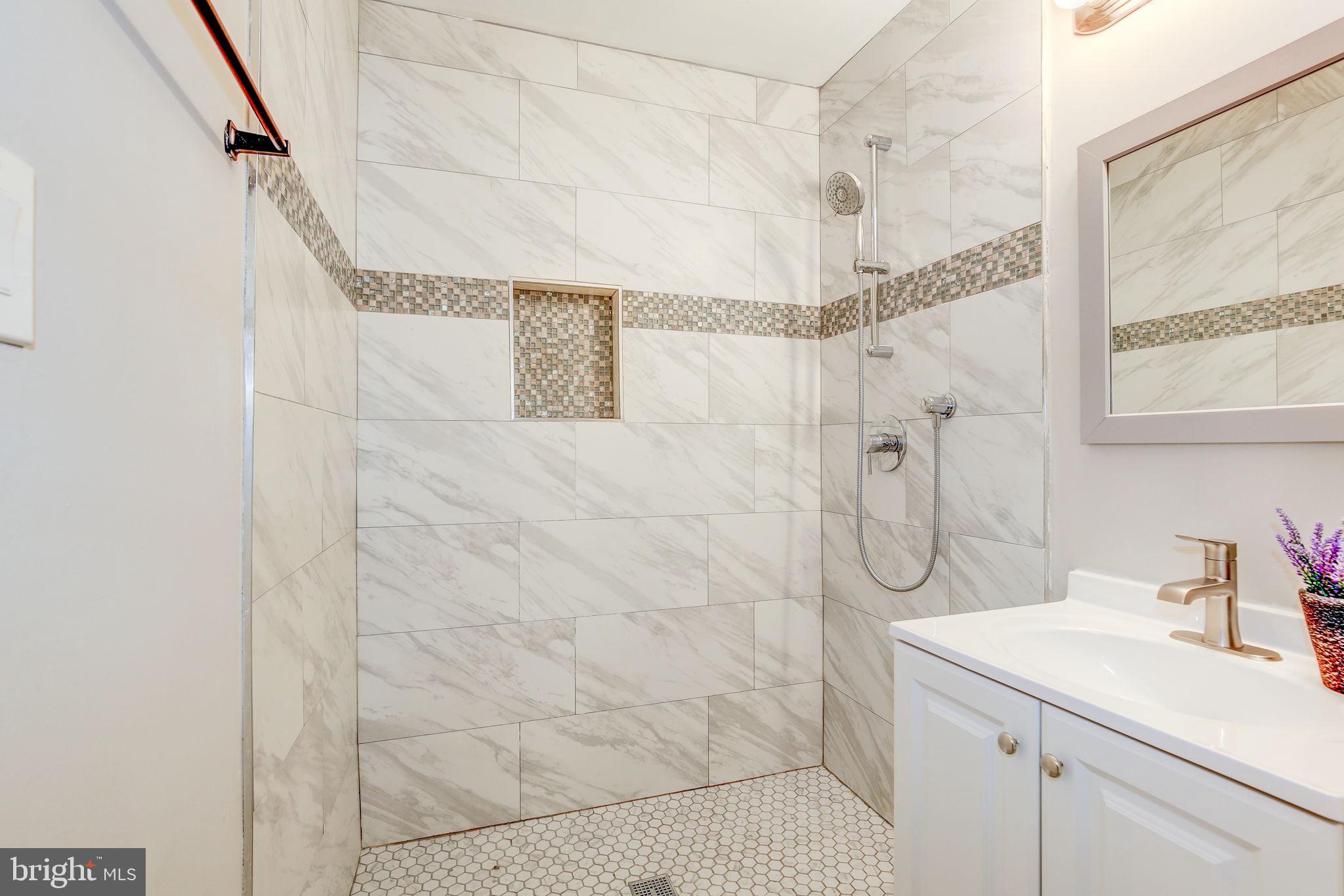 2394 Southgate Square Reston, VA 20191 - Photo 26 of 58 a bathroom with a sink shower and a mirror