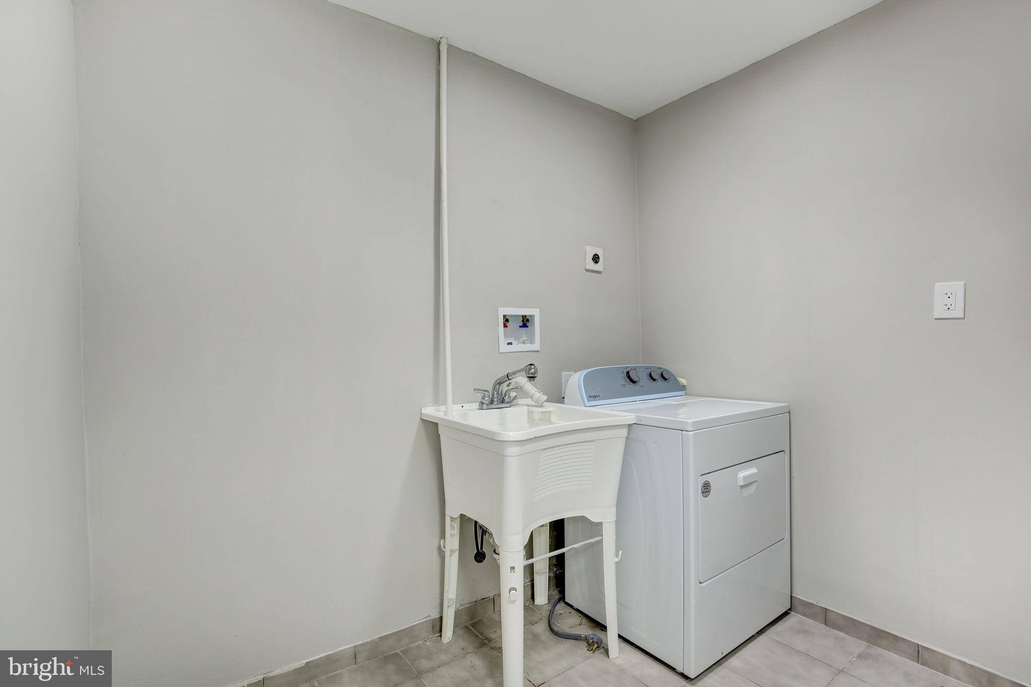 2394 Southgate Square Reston, VA 20191 - Photo 40 of 58 a utility room with dryer and washer