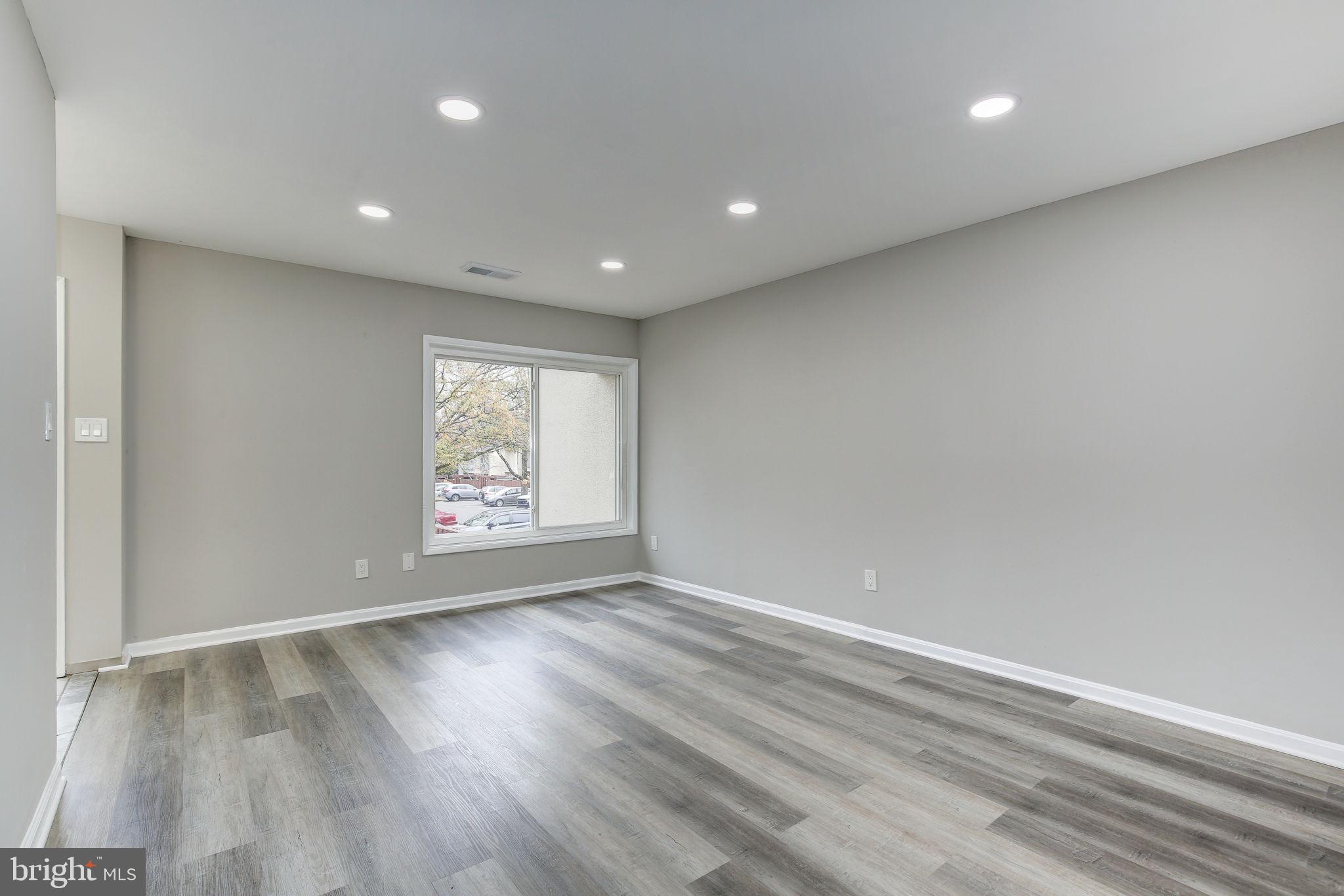 2394 Southgate Square Reston, VA 20191 - Photo 4 of 58 an empty room with wooden floor and window