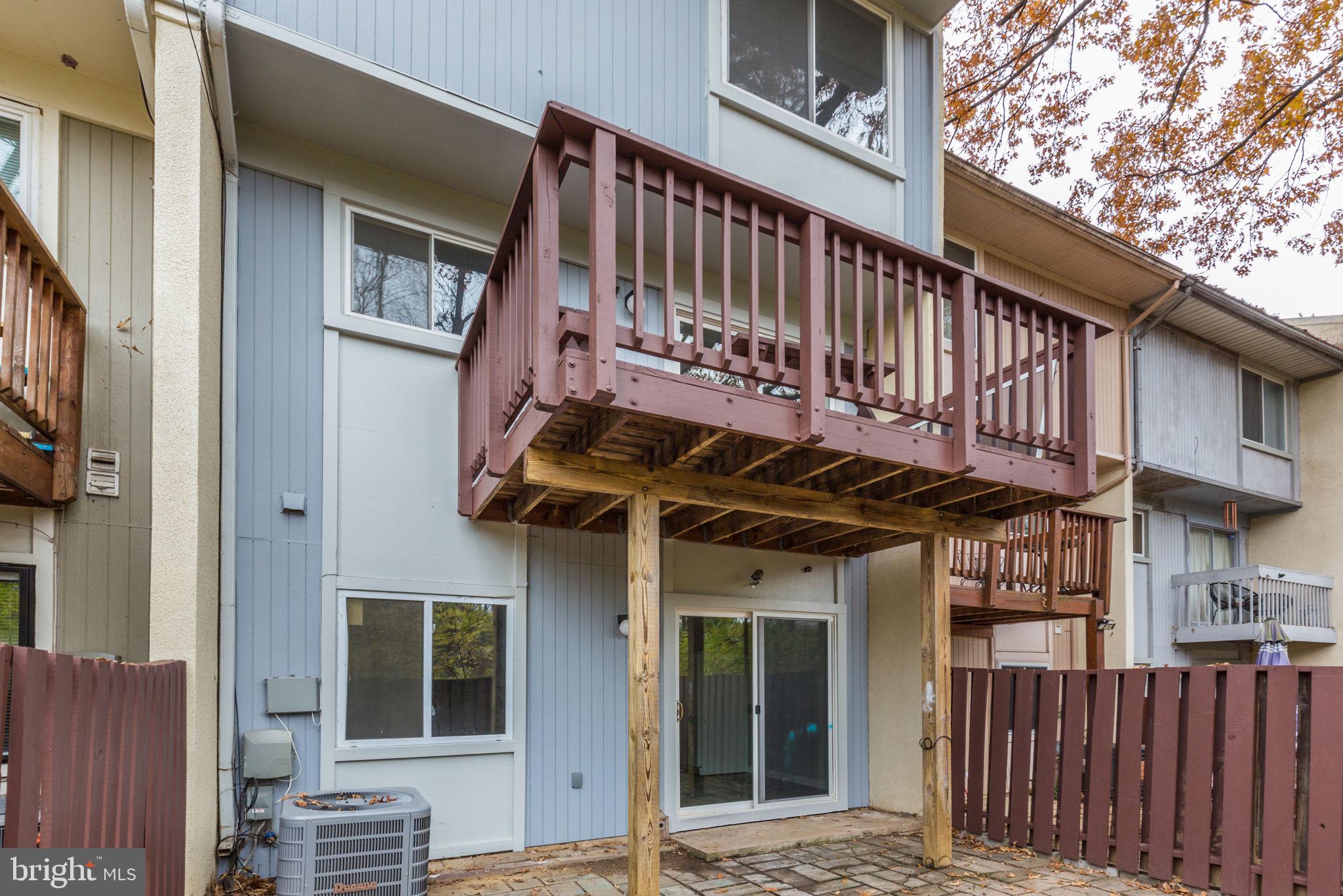 2394 Southgate Square Reston, VA 20191 - Photo 54 of 58 a view of a house with a deck