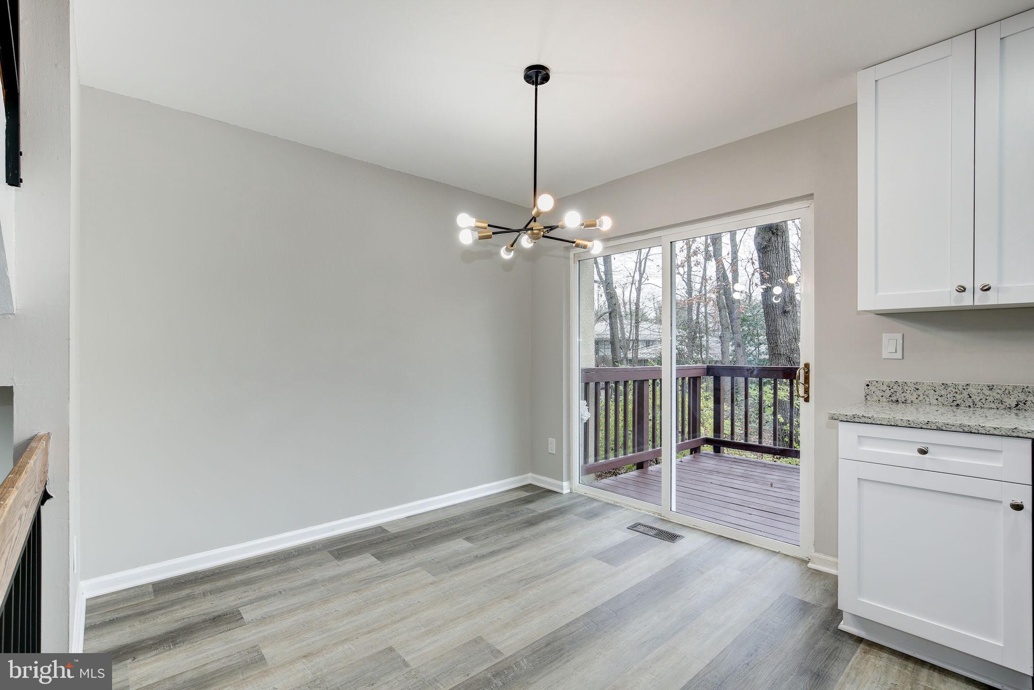 2394 Southgate Square Reston, VA 20191 - Photo 8 of 58 a view of a kitchen with a sink and dishwasher with wooden floor