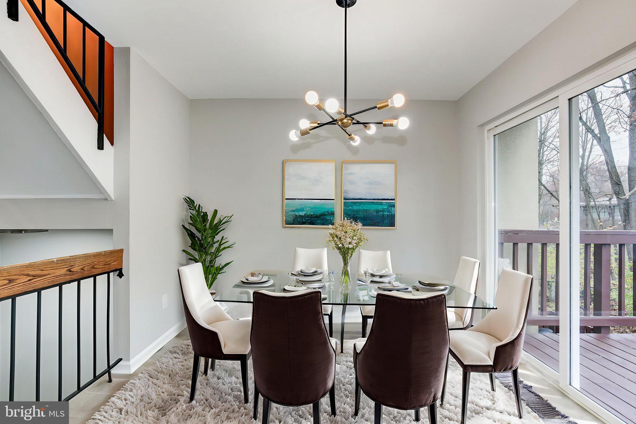 2394 Southgate Square Reston, VA 20191 - Photo 10 of 58 a view of a dining room with furniture window and wooden floor