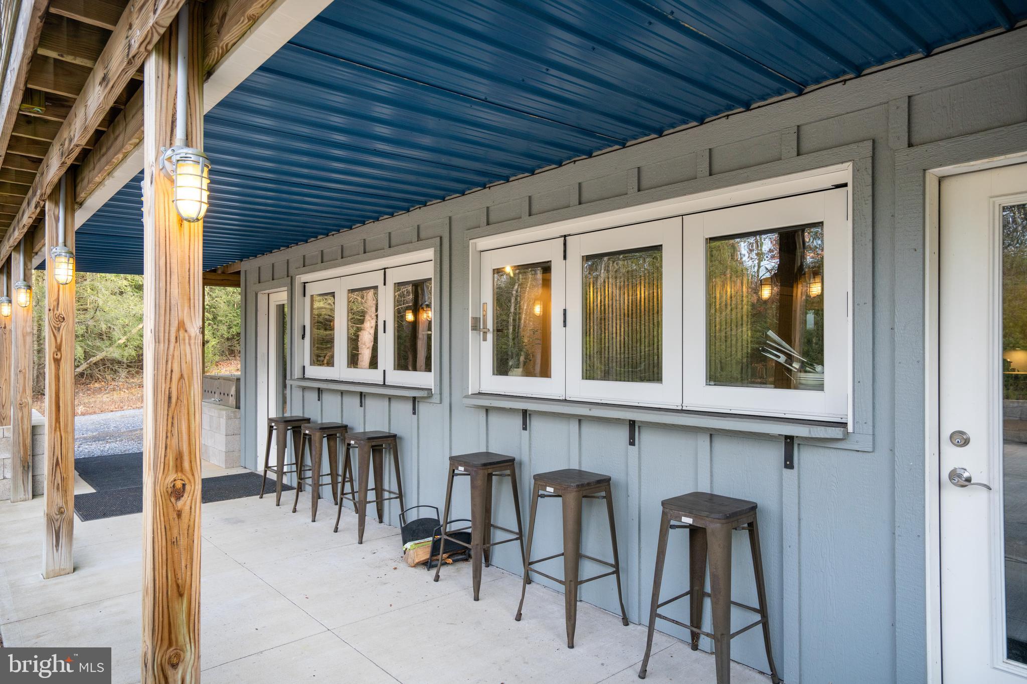 512 Decker Valley Road Spring Mills, PA 16875 - Photo 12 of 66 a view of an chairs and table in the balcony