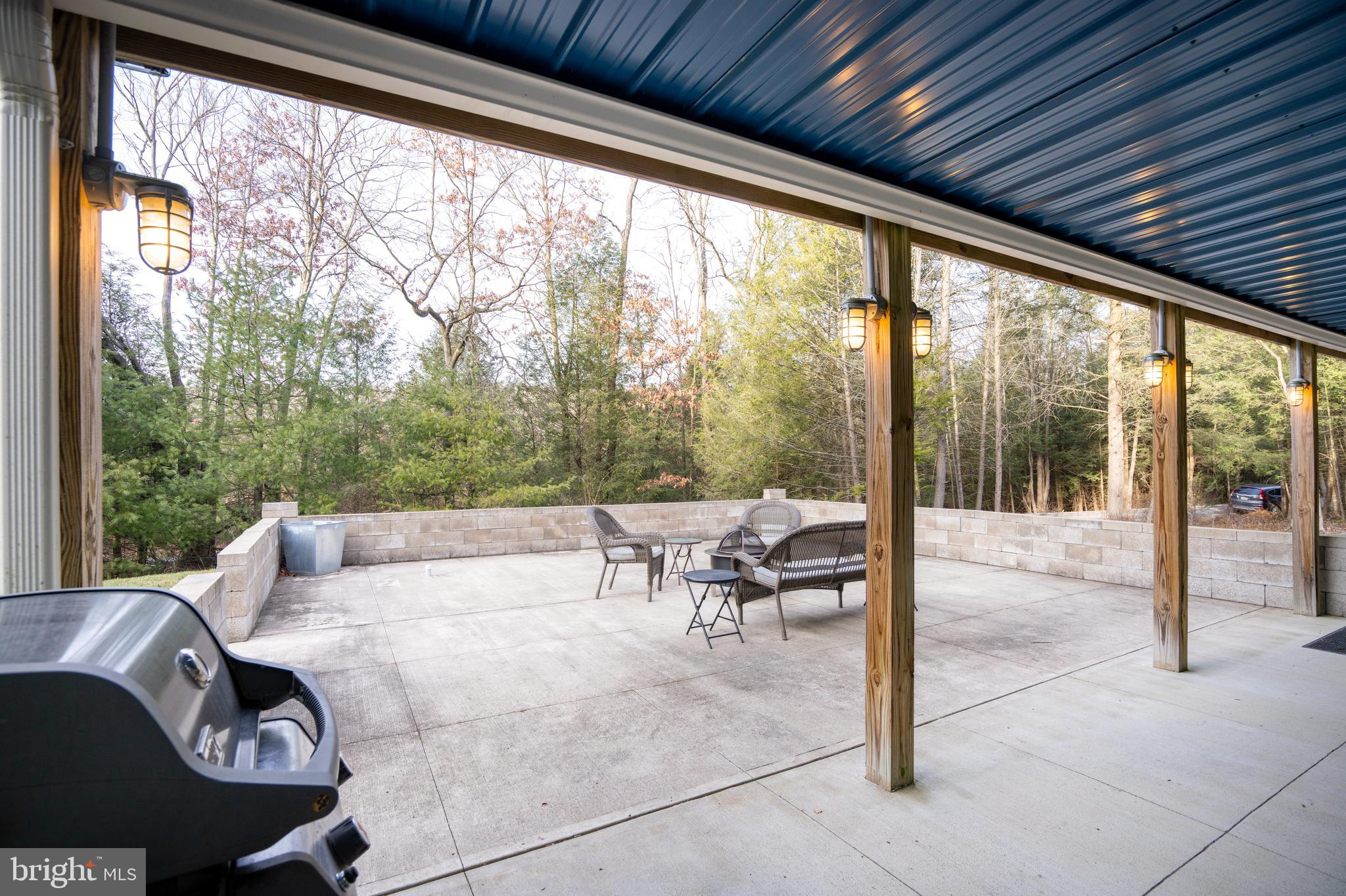 512 Decker Valley Road Spring Mills, PA 16875 - Photo 13 of 66 a living room with patio furniture and a floor to ceiling window