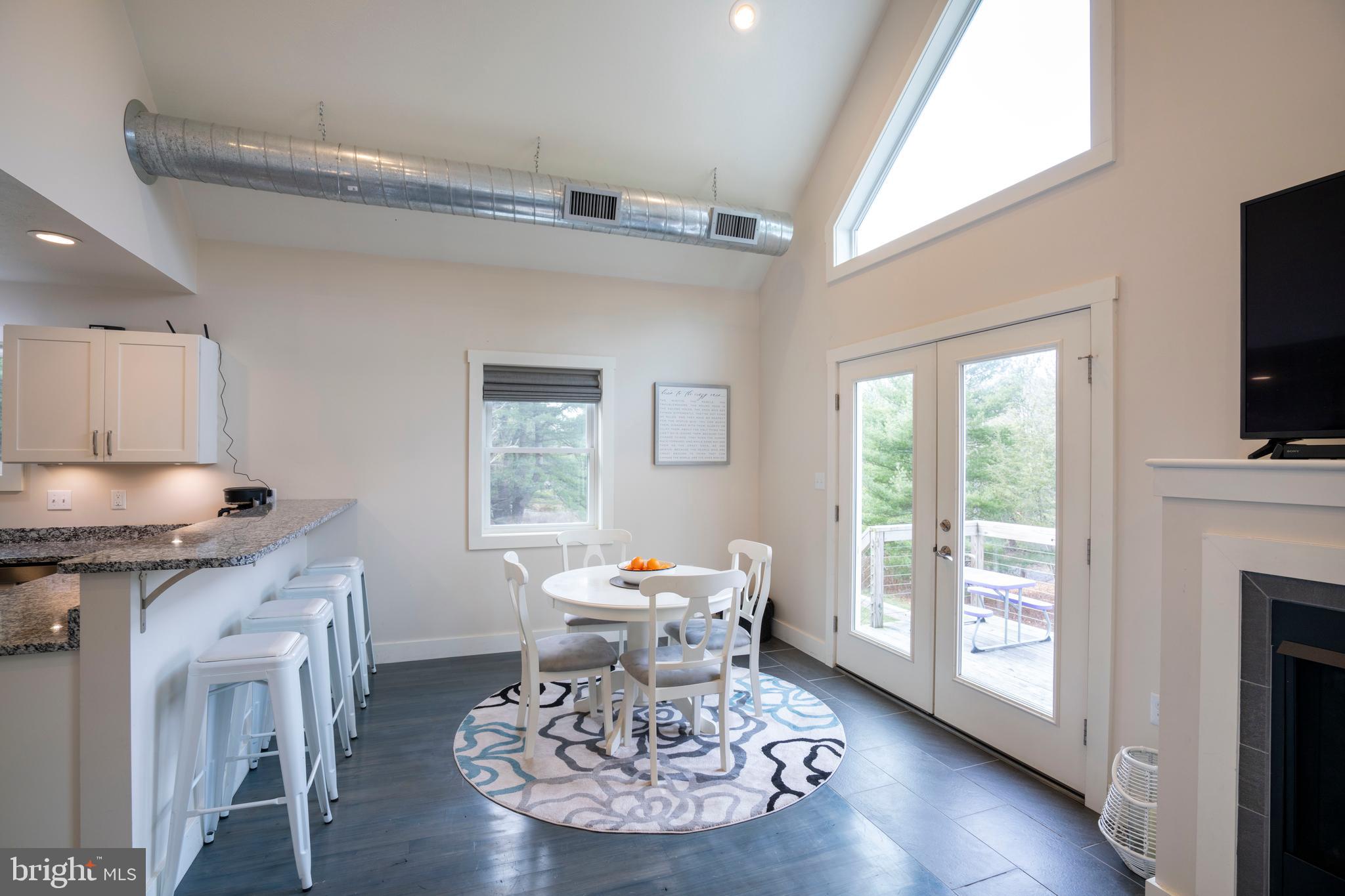 512 Decker Valley Road Spring Mills, PA 16875 - Photo 22 of 66 a living room with furniture a fireplace and a flat screen tv