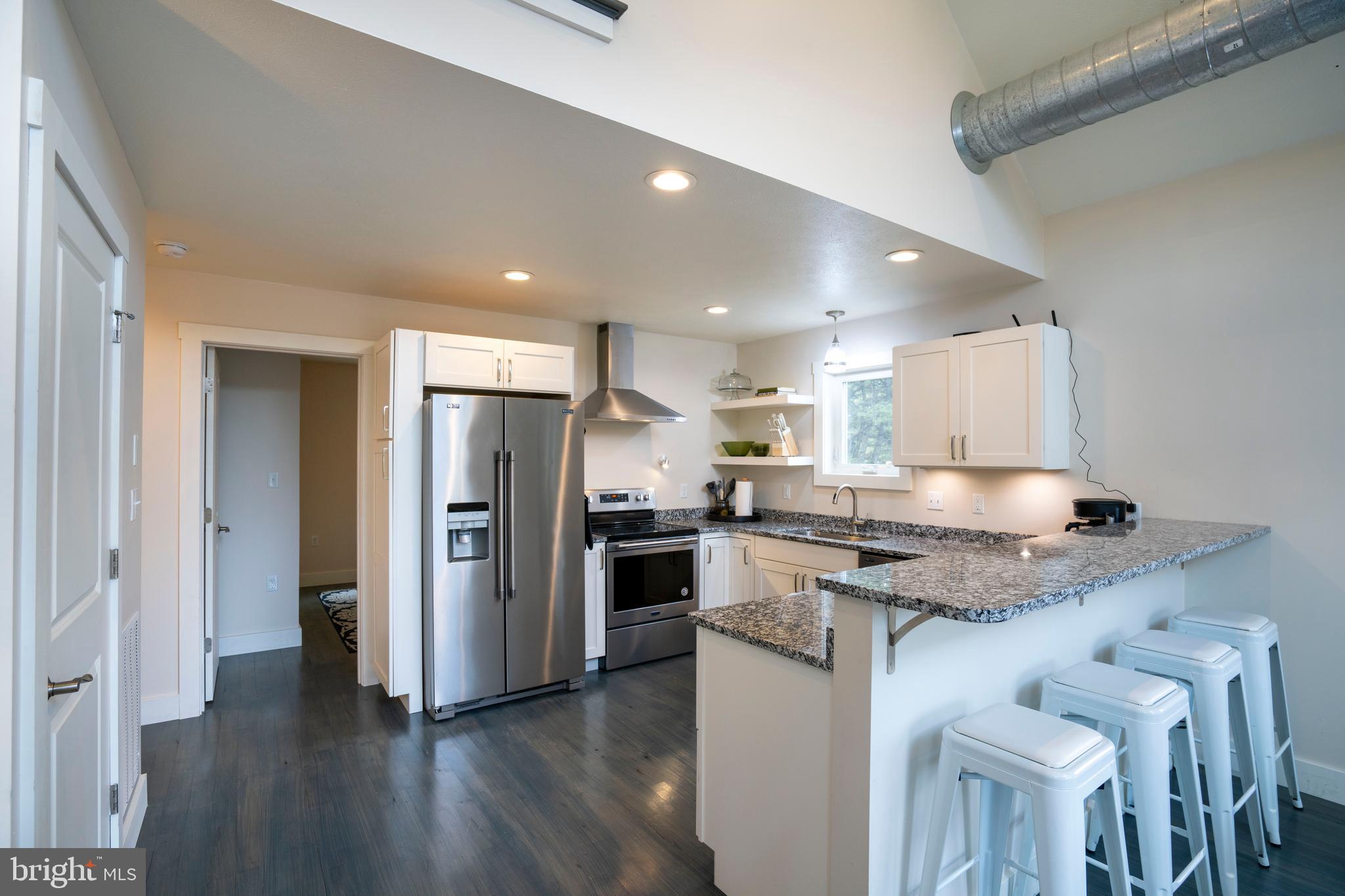 512 Decker Valley Road Spring Mills, PA 16875 - Photo 25 of 66 a kitchen with stainless steel appliances granite countertop a stove refrigerator and a sink