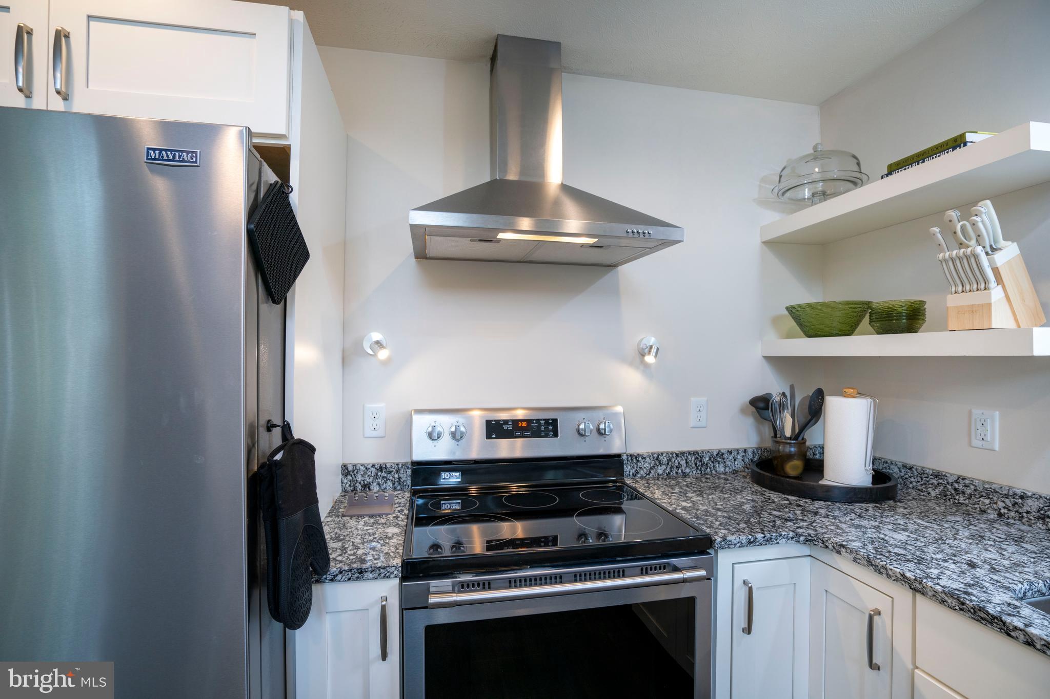 512 Decker Valley Road Spring Mills, PA 16875 - Photo 27 of 66 a kitchen with stainless steel appliances a stove and a refrigerator
