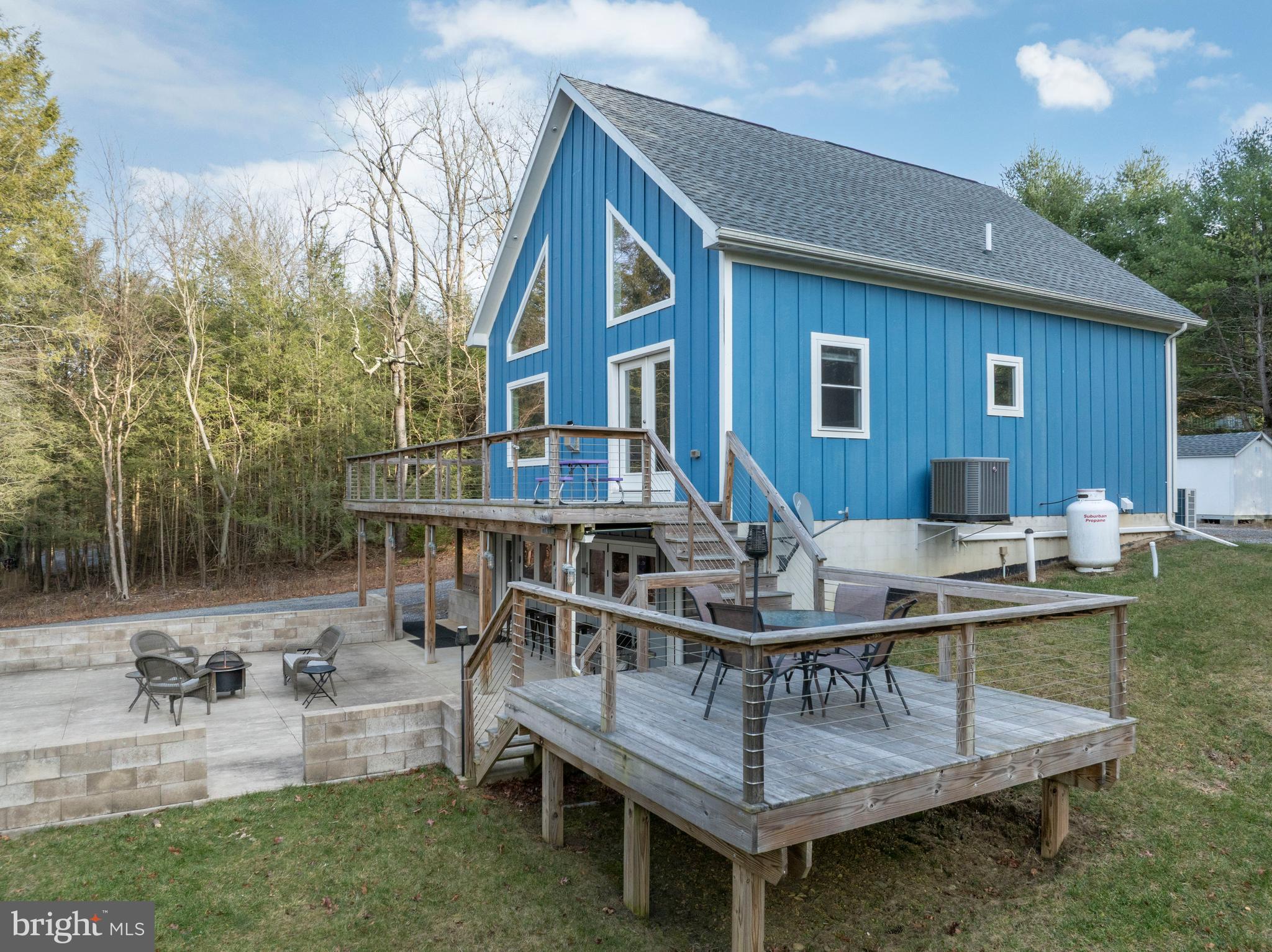 512 Decker Valley Road Spring Mills, PA 16875 - Photo 3 of 66 a backyard of a house with table and chairs
