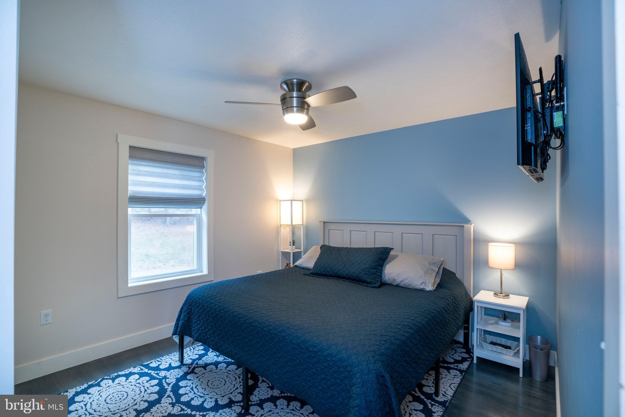 512 Decker Valley Road Spring Mills, PA 16875 - Photo 33 of 66 a bedroom with a bed and a window