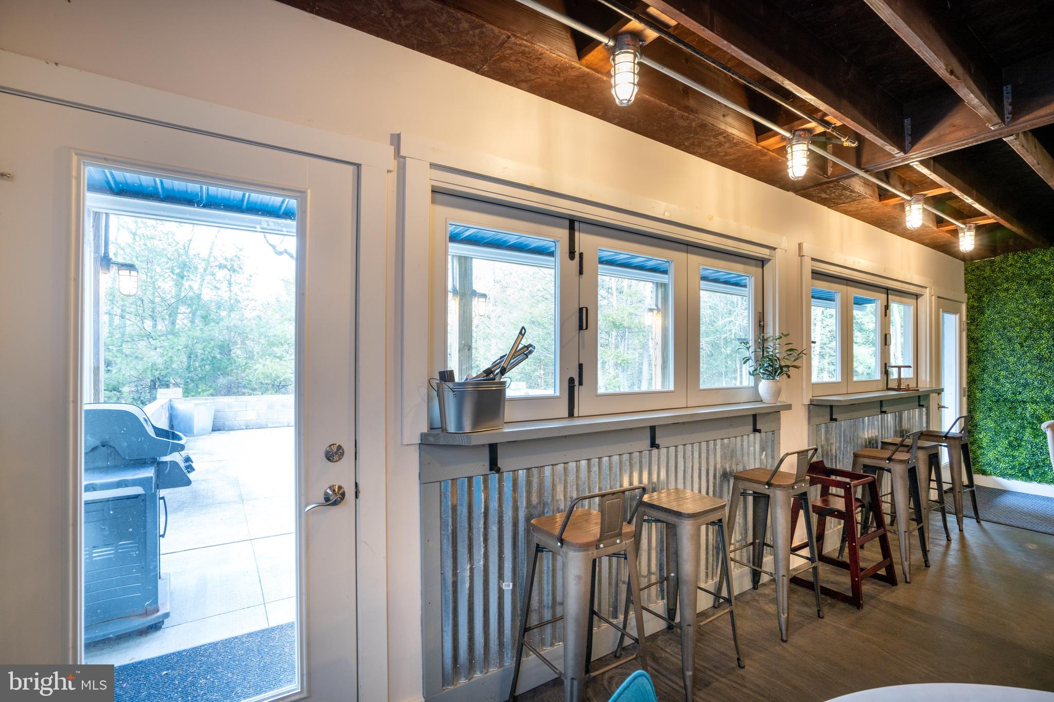 512 Decker Valley Road Spring Mills, PA 16875 - Photo 49 of 66 a view of a dining room with furniture window and wooden floor