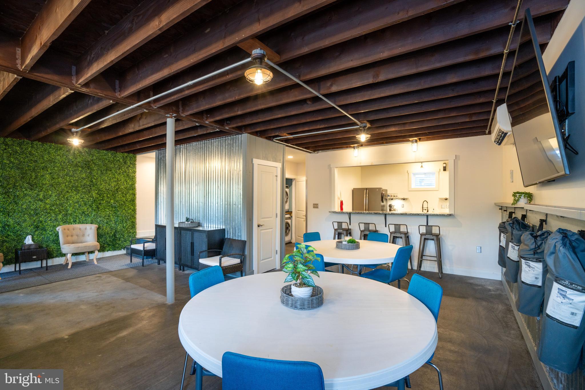 512 Decker Valley Road Spring Mills, PA 16875 - Photo 50 of 66 a view of a dining room with furniture a chandelier and wooden floor