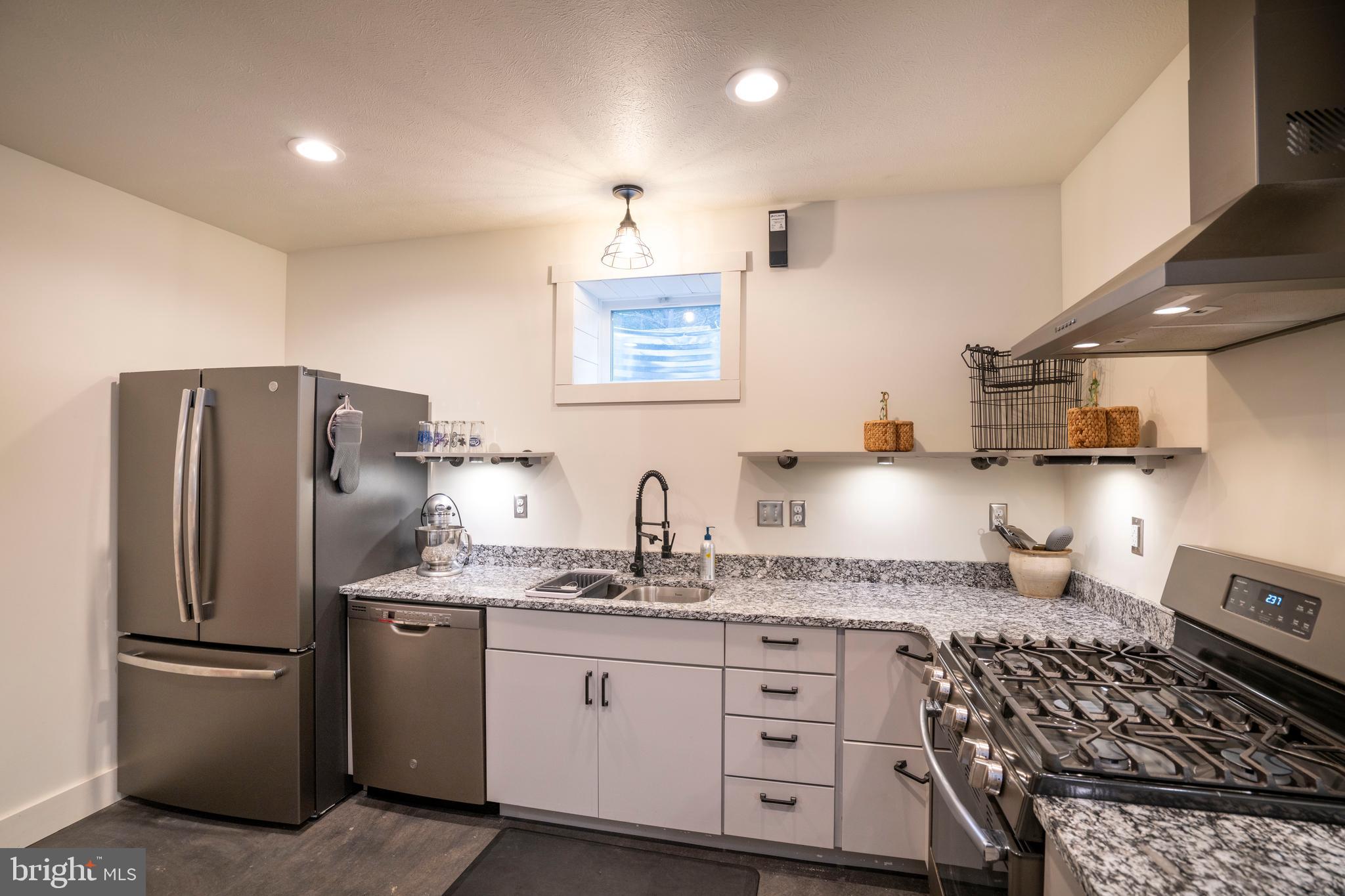 512 Decker Valley Road Spring Mills, PA 16875 - Photo 56 of 66 a kitchen with stainless steel appliances granite countertop a refrigerator sink and stove