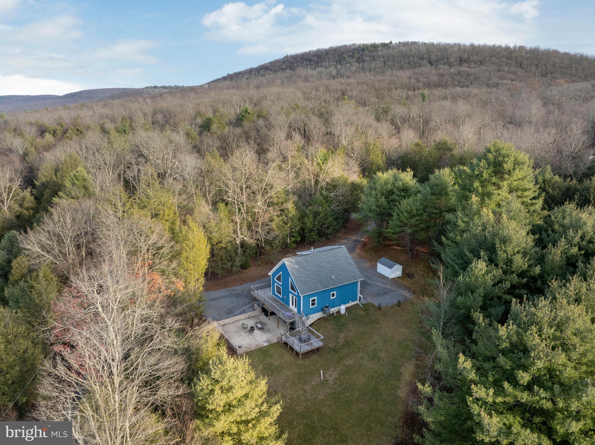 512 Decker Valley Road Spring Mills, PA 16875 - Photo 9 of 66 an aerial view of a house with mountain view