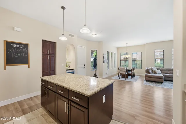 a view of living room with granite countertop furniture and a wooden floor
