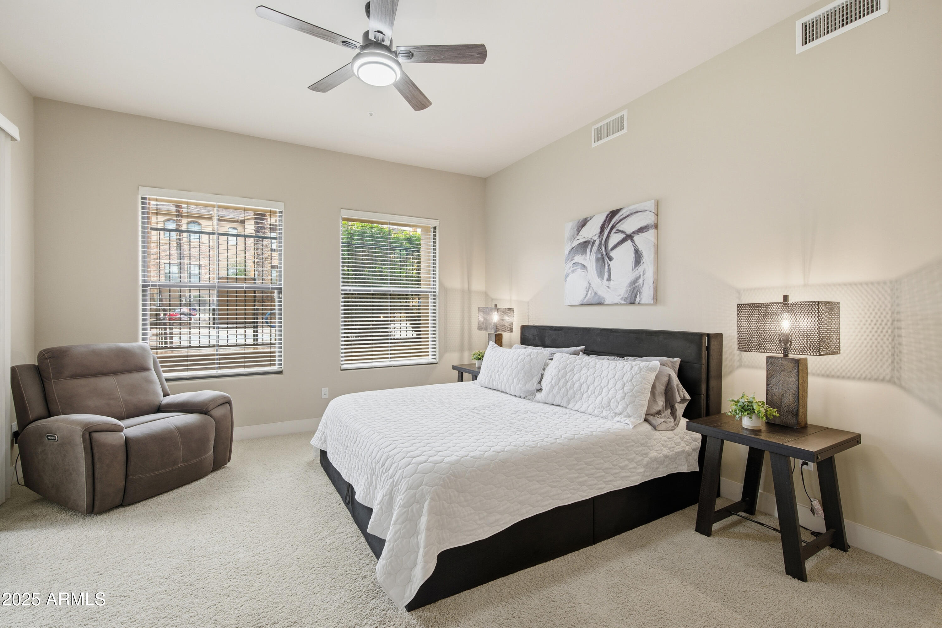 15550 South 5th Avenue, Unit 159 Phoenix, AZ 85045 - Photo 16 of 44 a bedroom with bed couch and window