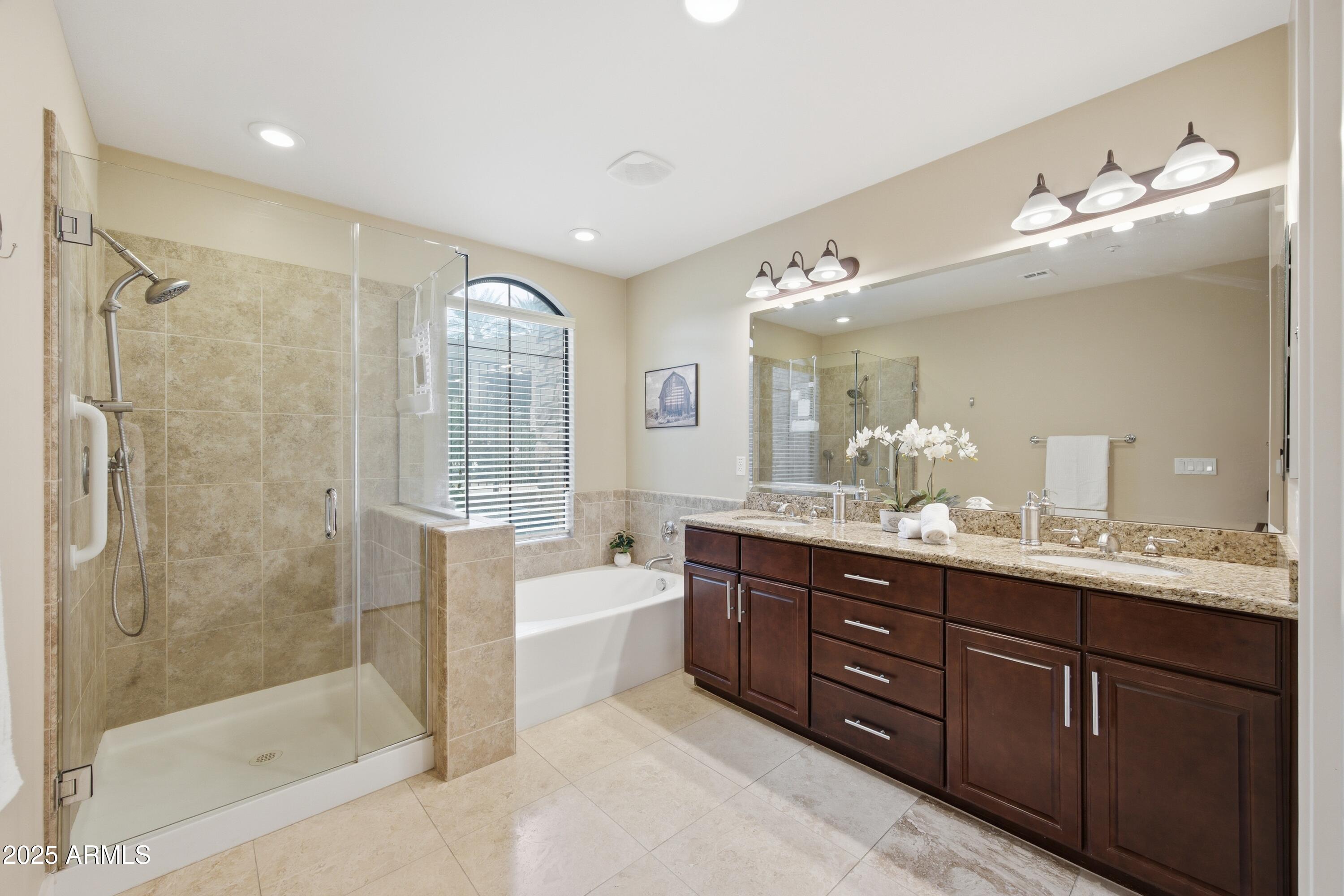 15550 South 5th Avenue, Unit 159 Phoenix, AZ 85045 - Photo 18 of 44 a spacious bathroom with a bathtub shower sink mirror and