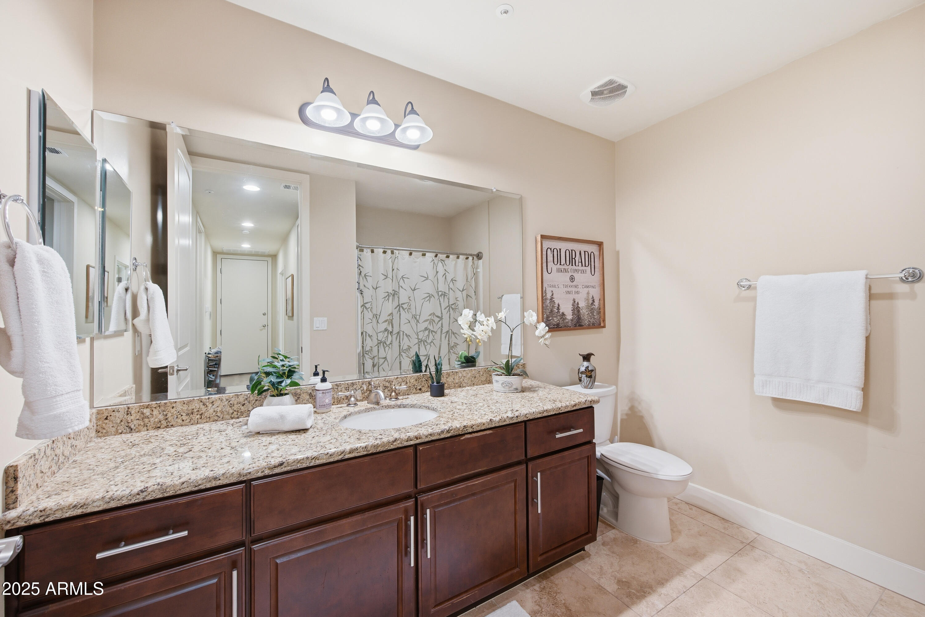 15550 South 5th Avenue, Unit 159 Phoenix, AZ 85045 - Photo 24 of 44 a bathroom with a granite countertop double vanity sinks and a mirror