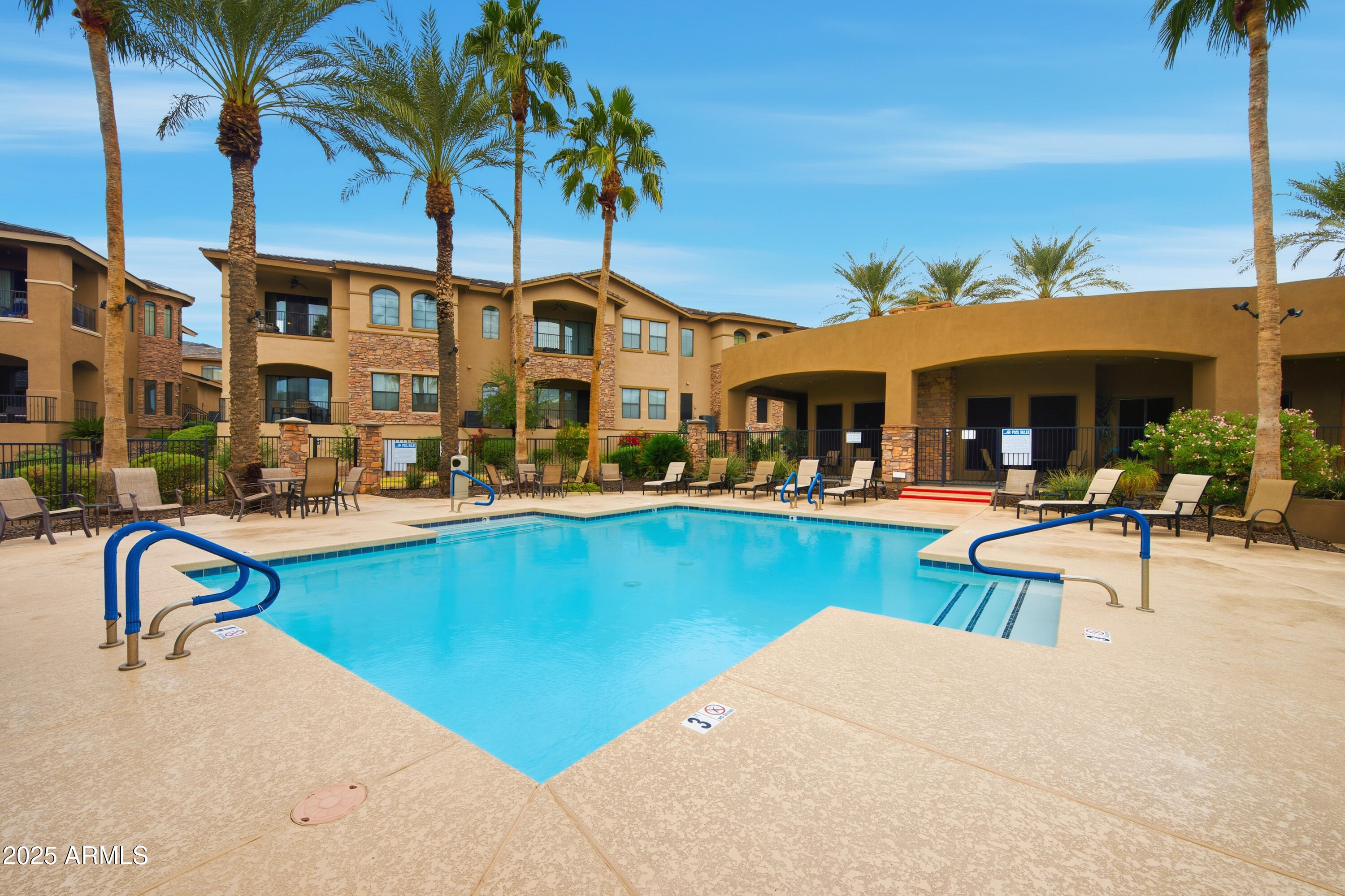 15550 South 5th Avenue, Unit 159 Phoenix, AZ 85045 - Photo 35 of 44 a view of a swimming pool with outdoor seating and a potted plants