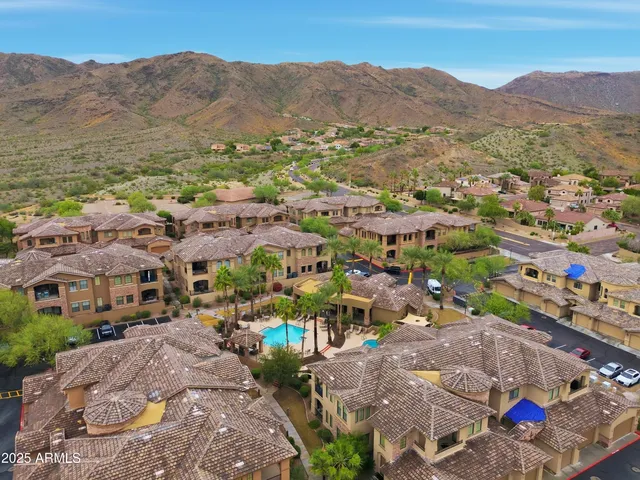 an aerial view of residential houses and outdoor space