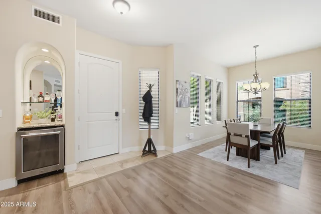 a view of a livingroom with furniture window and wooden floor